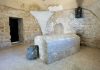 Famous Tomb LOCATED—Why Nobody Believes Him Interior of a historical site featuring a stone tomb and ancient walls