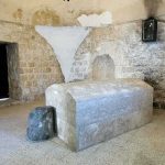 Famous Tomb LOCATED—Why Nobody Believes Him Interior of a historical site featuring a stone tomb and ancient walls