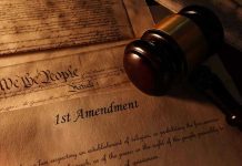 First Amendment document with gavel and Constitution background.