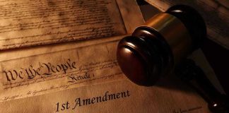 First Amendment document with gavel and Constitution background.