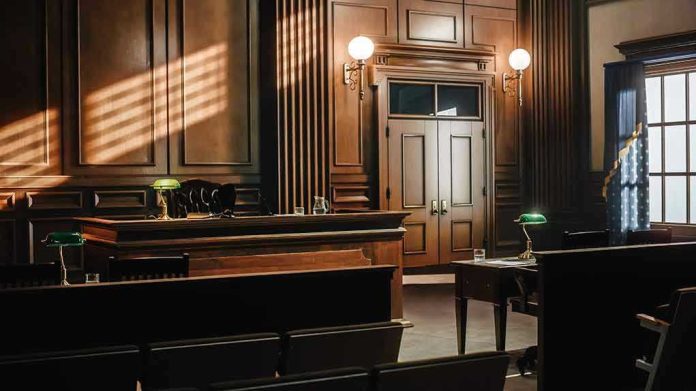 2056420760 Empty courtroom with wooden interior and green lamps.