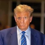 Trump Yanks Endorsement–Stuns Loyal GOP Rep Man in blue suit and striped tie, serious expression.