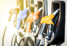 Colorful gas pump nozzles at a station.