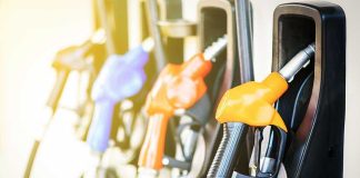 Colorful gas pump nozzles at a station.