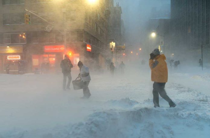 People walking in a snowy urban street during a blizzard