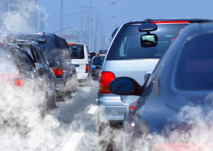 shutterstock_40584751.jpg Traffic jam with cars emitting exhaust fumes on a city road