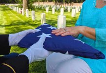 Deported Monster Walks FREE—Kills Vet Flag folded and handed over at gravesite ceremony.