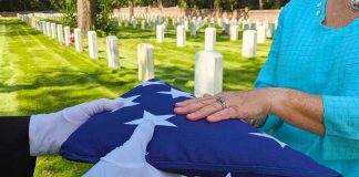 Flag folded and handed over at gravesite ceremony.