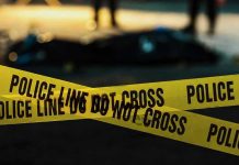 Closing-Time Ambush Shocks Downtown Austin Police tape marking a crime scene at night.