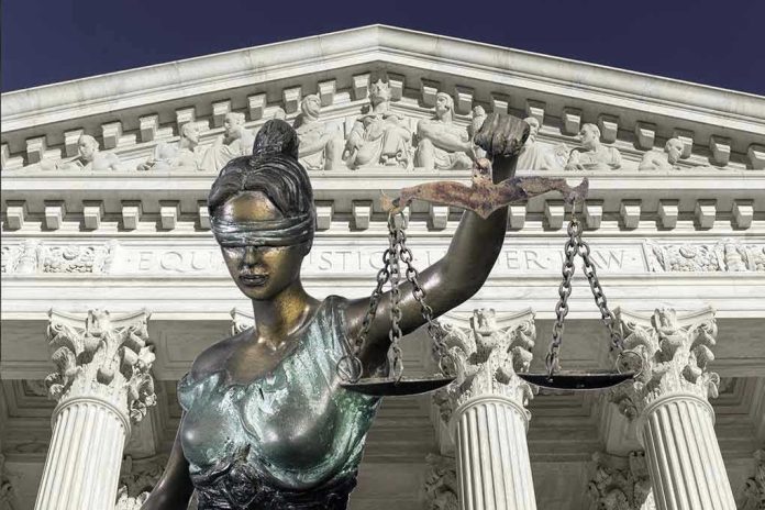 Lady Justice statue in front of courthouse.