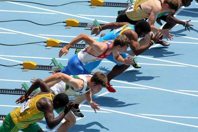 shutterstock_111279011.jpg Athletes in starting position for a sprint race on a track