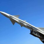 Missiles Over Dubai: Night Sky ERUPTS A military missile pointed upwards against a clear blue sky