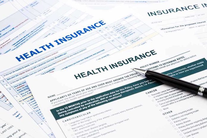 shutterstock_190551629.jpg Close-up of health insurance application forms with a pen