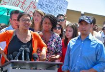 Group of people at an outdoor press event.