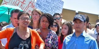 Group of people at an outdoor press event.