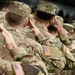Classified Tactics LEAKED — Army Soldier Arrested Soldiers in camouflage uniforms saluting in formation outdoors