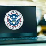 Laptop displaying U.S. Department of Homeland Security logo.