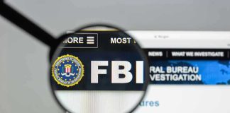 FBI Director: Terror Sleeper Cells REAL in America FBI website shown through magnifying glass.