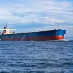 China’s Trick Ship Blindsides U.S. Fleet A large cargo ship sailing on the ocean under a blue sky