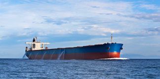 China’s Trick Ship Blindsides U.S. Fleet A large cargo ship sailing on the ocean under a blue sky