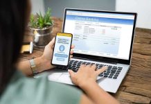 Person using online banking on laptop and smartphone.