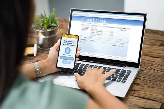 Person using online banking on laptop and smartphone.