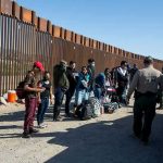Border Czar Shares DISGUSTING ICE Prison Scene Border patrol agents interact with a group of people.