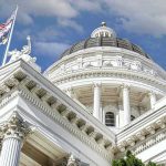 GOP Rep Makes Senator CRY During Explosive Testimony! Capitol building dome and flags under a blue sky.