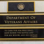 VA’s Paper Trap: 300,000 Left Hanging! Department of Veterans Affairs building sign with quote.