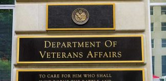 VA’s Paper Trap: 300,000 Left Hanging! Department of Veterans Affairs building sign with quote.