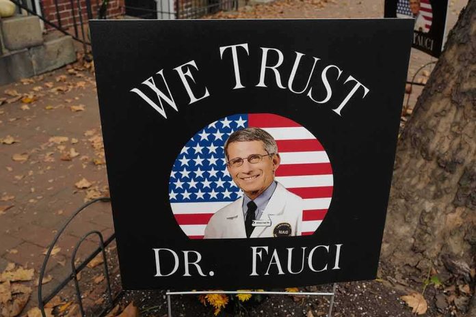 yard sign with portrait of a doctor over a U.S. flag