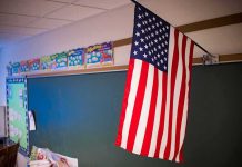American flag hanging in a classroom