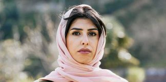 Woman in a pink headscarf outdoors