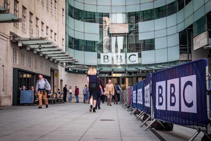 People walking outside the BBC building entrance