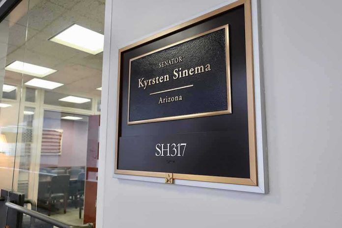 Office door plaque with gold trim outside a glass-walled conference room