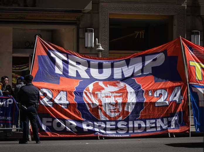 Large political banner at street protest with police nearby