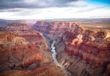 Grand Canyon with river winding through layered red cliffs