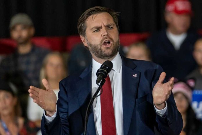 54801cb8-0515-4c34-a2d8-f79705e6683e_shutterstock2542628059jpg Man in suit speaking at a podium