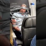 Out-of-Control Passenger Duct Taped Mid-Flight Unruly passenger arrested after being restrained with duct tape during flight