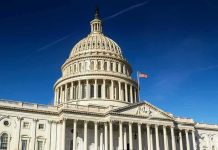 United States Capitol dome against clear blue sky