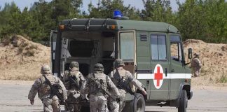 Ambassador’s Son Attacked Crossing Border – In Critical Condition Soldiers running towards a medical vehicle during a military operation