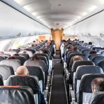 Out-of-Control Passenger Duct Taped Mid-Flight Airplane cabin with passengers seated in rows