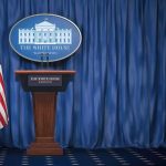 TRUMP Launches Space Academy – What’s It For? White House press briefing podium with U.S. flag and blue curtain