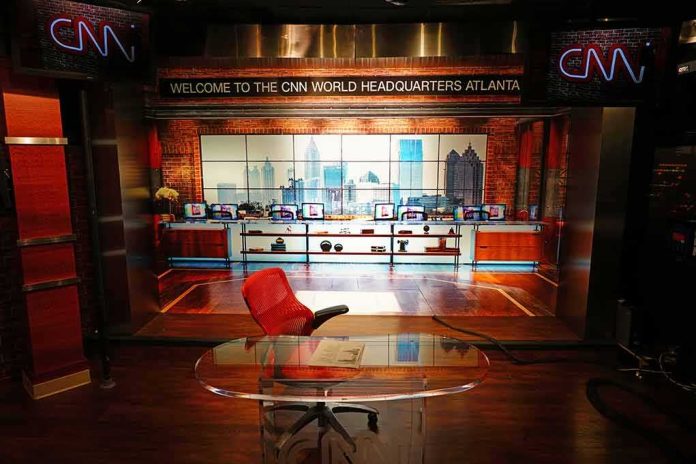 CNN studio set with empty anchor desk and red chair