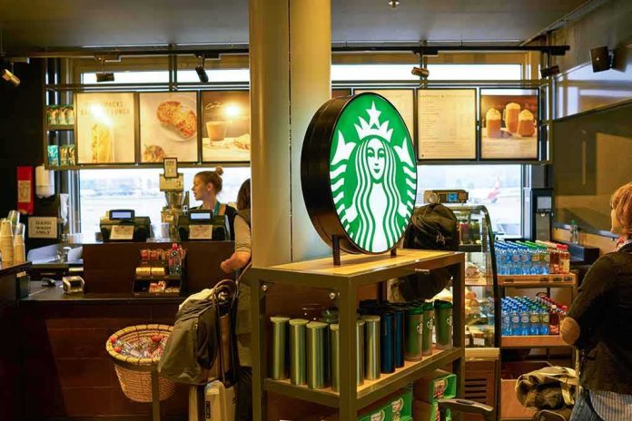 Starbucks counter with illuminated logo and customers