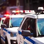 Governor SLAMS Flock Cameras — Wants Them Gone police cars with flashing lights on a city street
