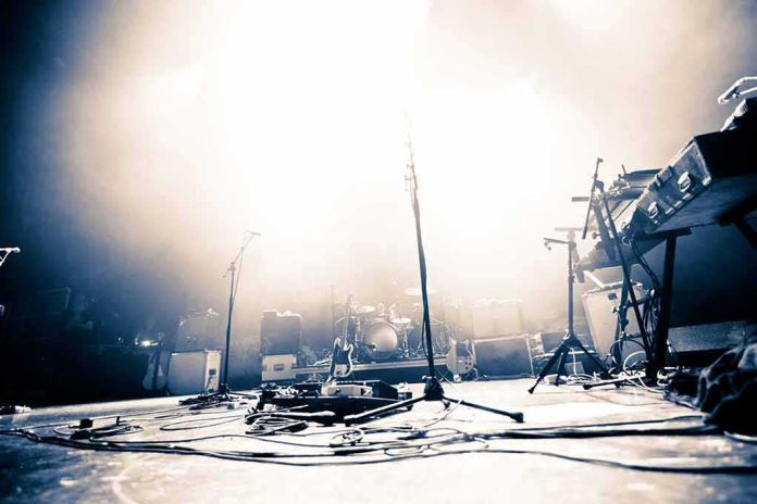 Empty concert stage with instruments and bright lights