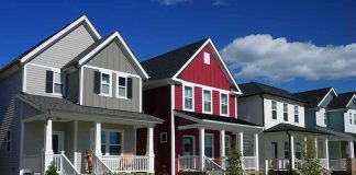 Row of modern suburban houses with front porches