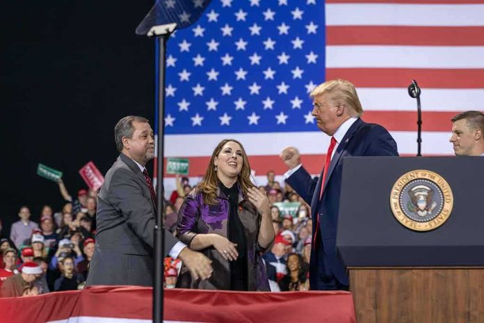 shutterstock_1677450232 Donald Trump with Eugene Sims and Andreas Hestler on stage at a rally