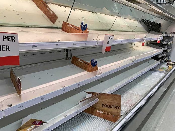 shutterstock_1692347131 Empty grocery store refrigerated shelves